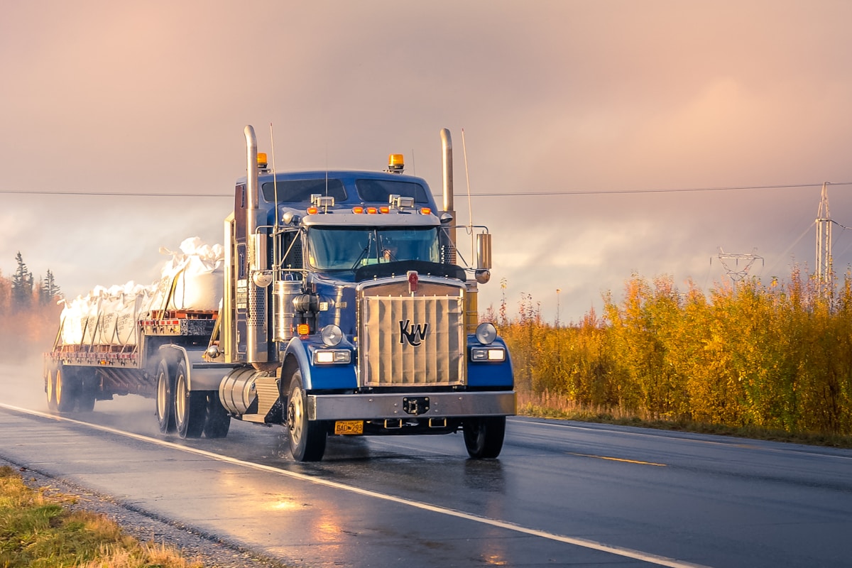 VWTRUCKN LLC tractor-trailer on the highway at dusk
